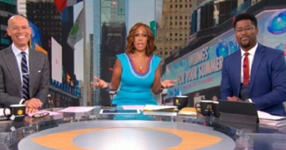 "CBS Mornings" host Gayle King, center, and co-hosts Vladimir Duthiers, left, and Nate Burleson, right, are pictured on the set of the show on Monday.