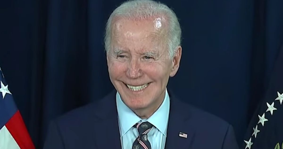 President Joe Biden smiles while answering a reporter's question about President-elect Donald Trump following his remarks on the death of former President Jimmy Carter on Sunday.