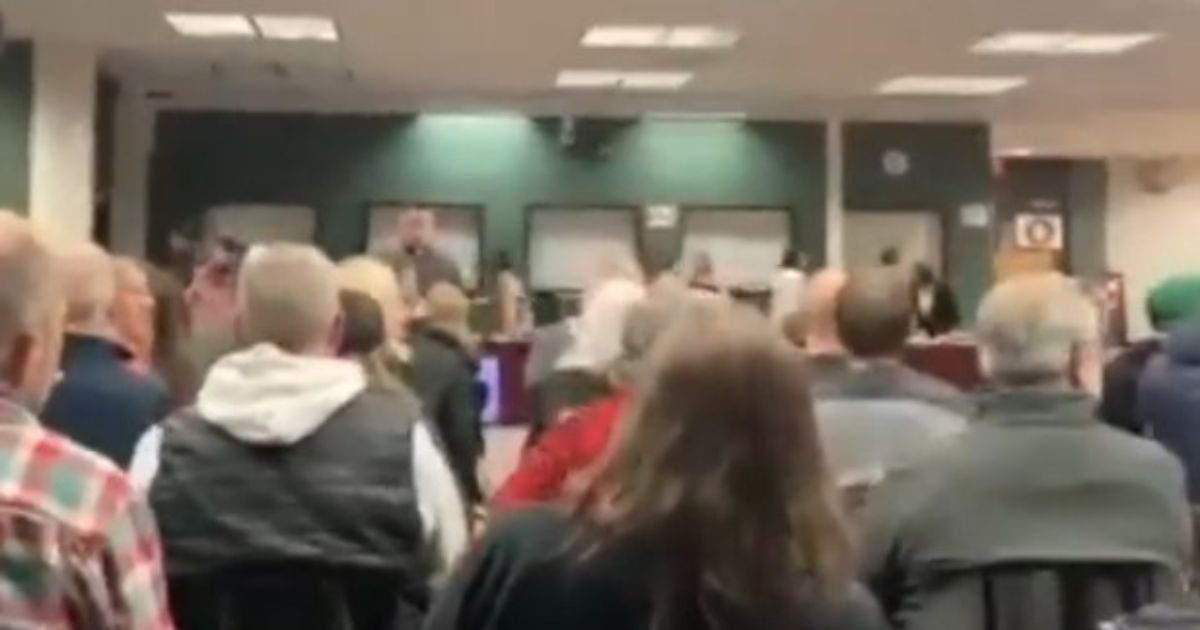 Penfield Central School District parents watch in dismay as school board members leave a meeting.